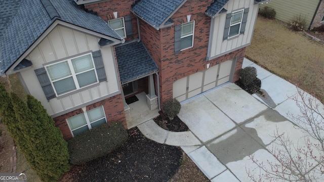 exterior space with driveway and an attached garage