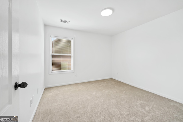 868 Still Hill Ln, Lawrenceville, GA 30045 - carpeted spare room featuring baseboards