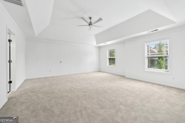 868 Still Hill Ln, Lawrenceville, GA 30045 - unfurnished room with a tray ceiling, ceiling fan, carpet, healthy amount of natural light, and crown molding