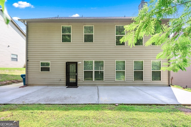 868 Still Hill Ln, Lawrenceville, GA 30045 - back of property featuring a patio and a yard