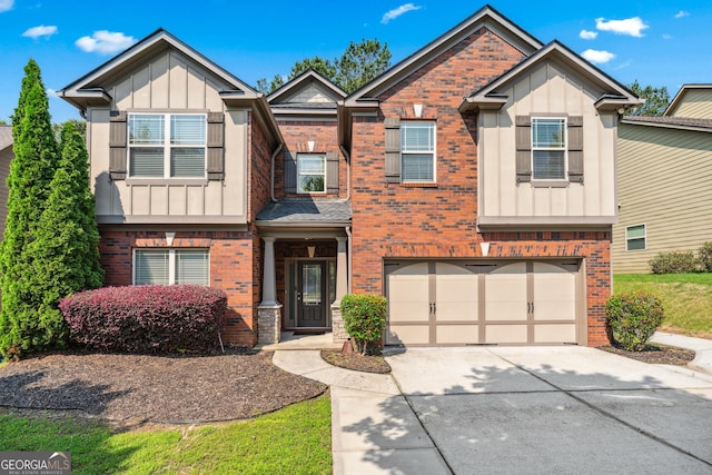 868 Still Hill Ln, Lawrenceville, GA 30045 - view of front facade with brick siding, driveway, a garage, and board and batten siding