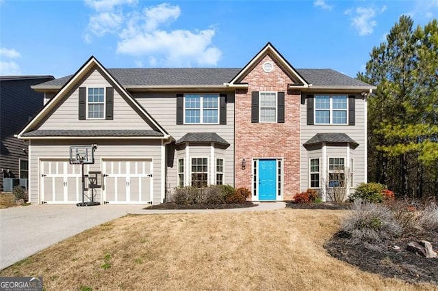 view of front facade with a garage, concrete driveway, brick siding, and a front lawn