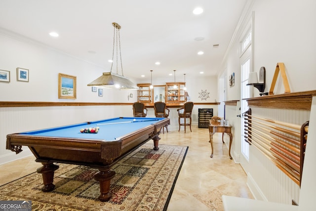 game room with bar, billiards, and ornamental molding