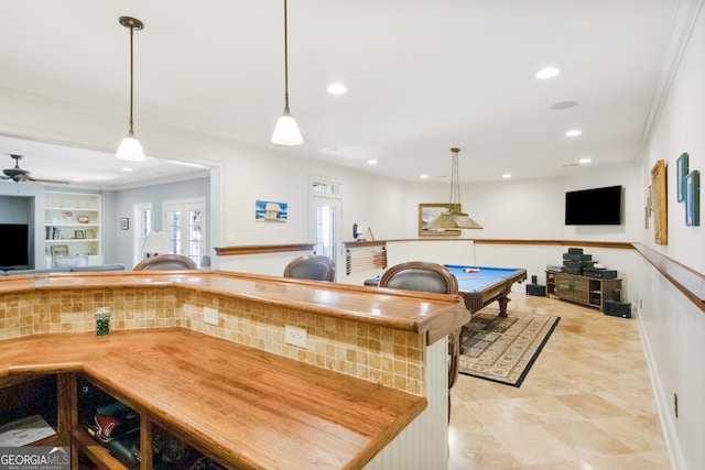 kitchen with ceiling fan, pendant lighting, ornamental molding, pool table, and built in features