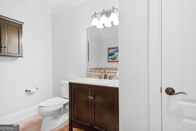 bathroom featuring toilet, vanity, ornamental molding, and tile patterned flooring