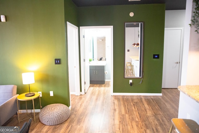 interior space featuring light wood finished floors and baseboards