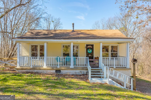 view of front of property with a porch, a front yard, crawl space, and stairway