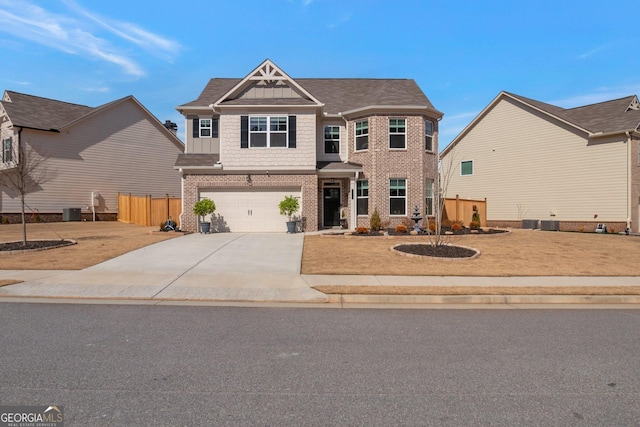 view of front of property featuring central AC and a garage