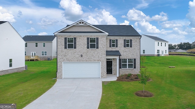 view of front of home featuring a front yard and a garage