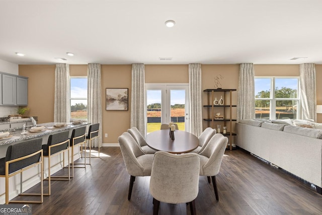 dining space featuring dark hardwood / wood-style floors