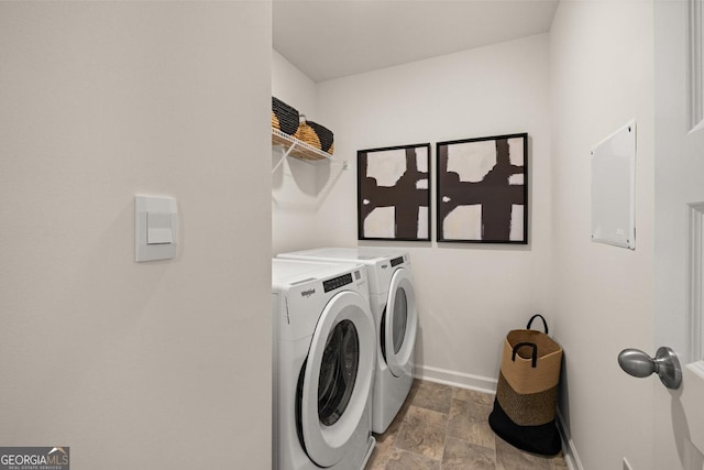 washroom featuring washing machine and dryer