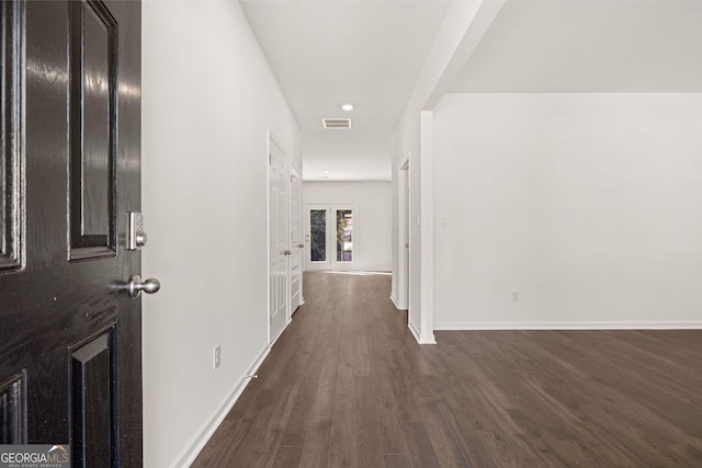 hall with dark wood-type flooring