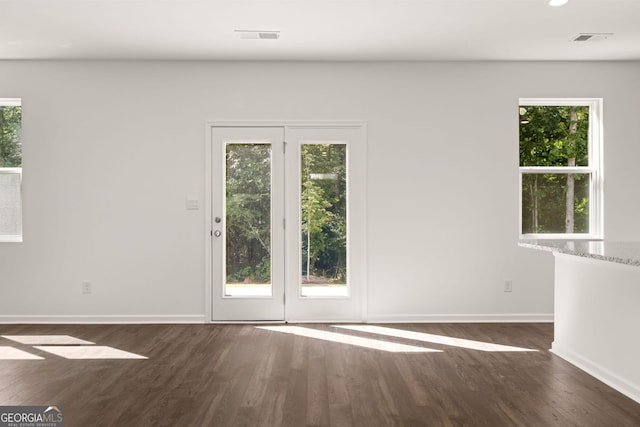 doorway to outside featuring dark hardwood / wood-style flooring