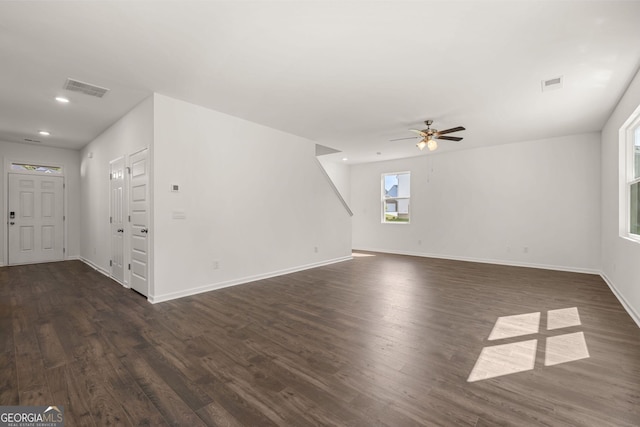 unfurnished living room with ceiling fan and dark hardwood / wood-style floors