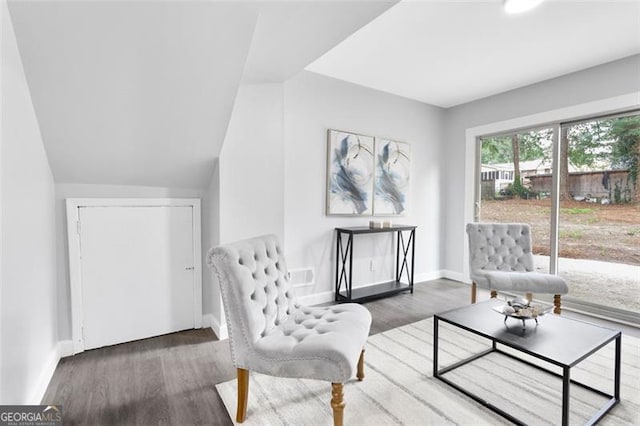 living area featuring dark wood finished floors and baseboards