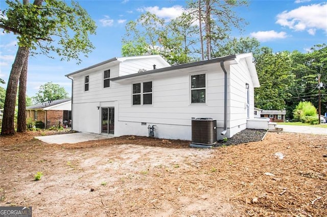 back of house featuring central air condition unit, crawl space, and a patio