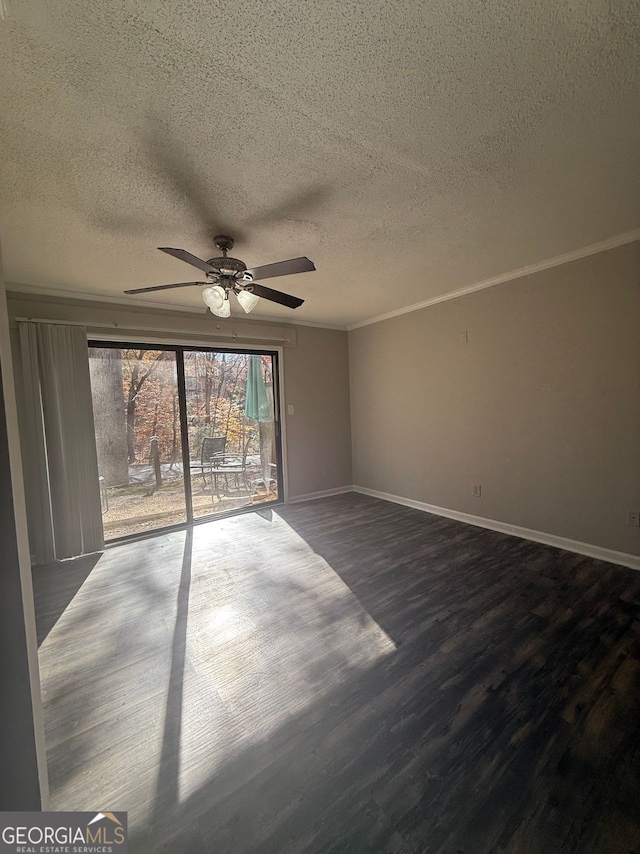 spare room with a textured ceiling, ornamental molding, ceiling fan, and wood-type flooring