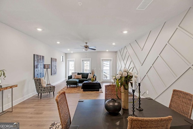 dining room featuring visible vents, baseboards, ceiling fan, light wood-type flooring, and recessed lighting