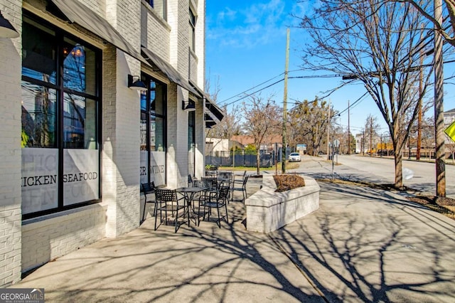 view of patio / terrace featuring fence
