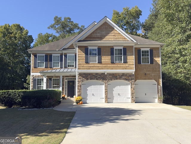 view of front of home with an attached garage, concrete driveway, and stone siding