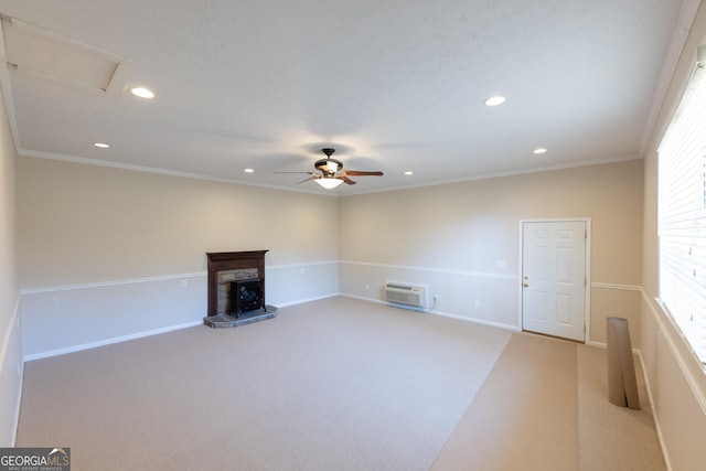 unfurnished living room with recessed lighting, light colored carpet, and a fireplace with raised hearth