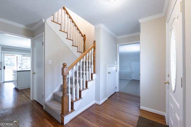 stairs featuring ornamental molding, wood finished floors, and baseboards