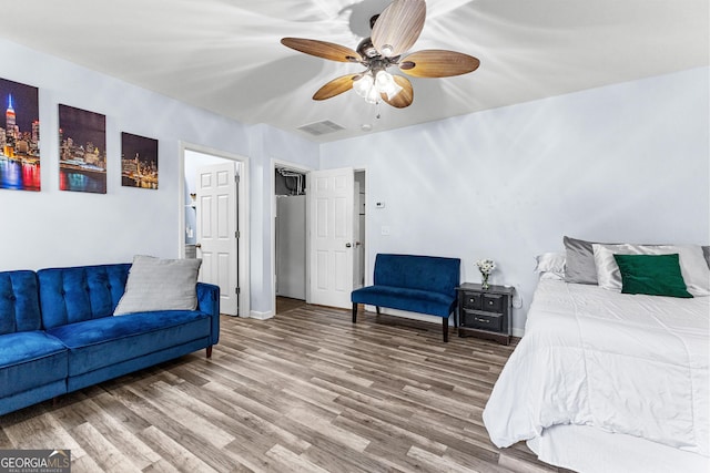 bedroom featuring hardwood / wood-style flooring and ceiling fan