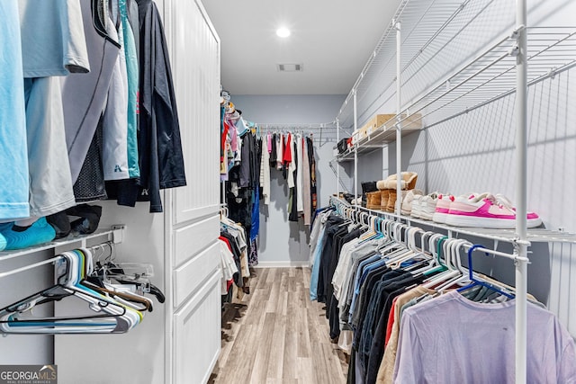 spacious closet with light wood-type flooring