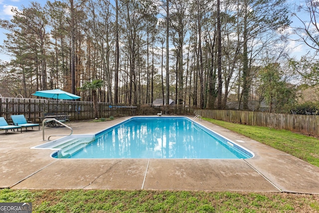 view of swimming pool with a fenced in pool, a patio, and a fenced backyard