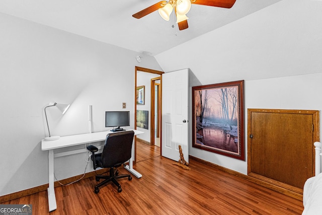 office area featuring ceiling fan, vaulted ceiling, and wood-type flooring