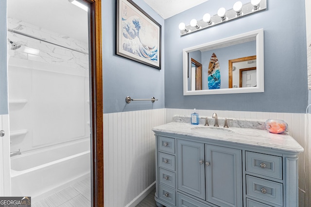 bathroom featuring bathtub / shower combination and vanity