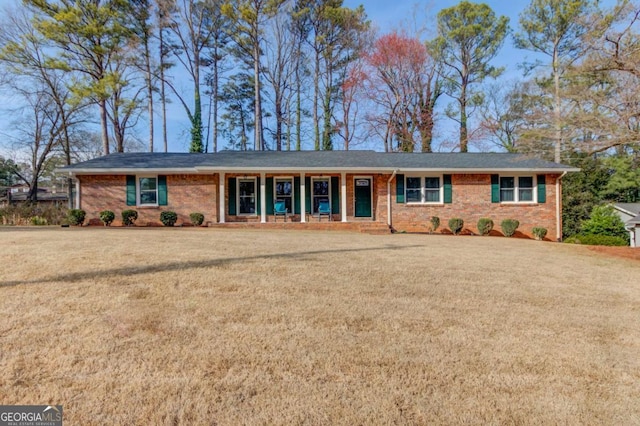 ranch-style house featuring a front yard and a porch