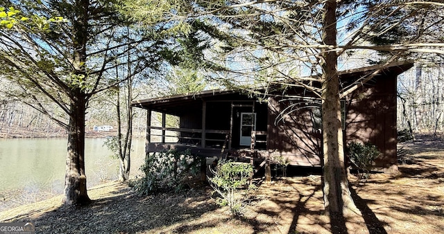 view of outbuilding featuring a water view