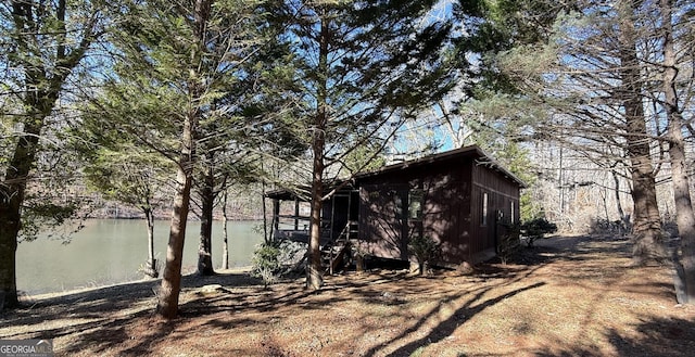 view of side of home featuring a water view