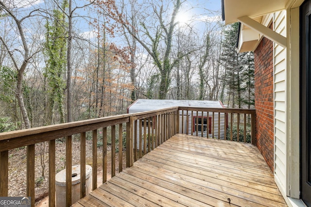 wooden deck with an outbuilding