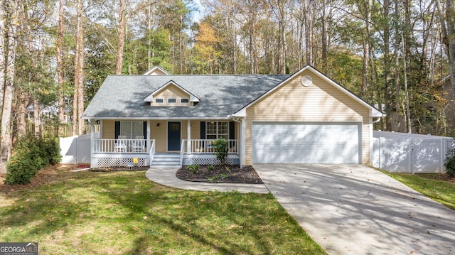 view of front facade with a garage, a front lawn, and a porch