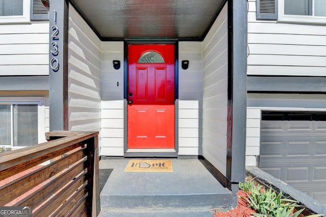 property entrance with a garage