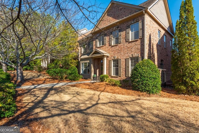 view of front of property featuring brick siding