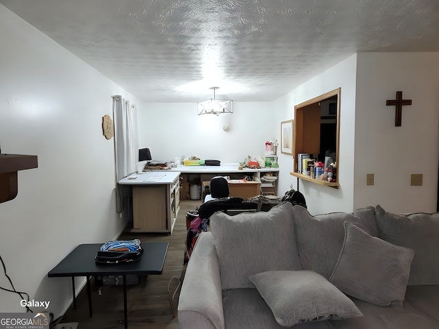 living room featuring a textured ceiling and wood finished floors