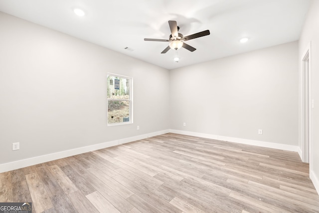 spare room featuring recessed lighting, visible vents, light wood-style flooring, a ceiling fan, and baseboards