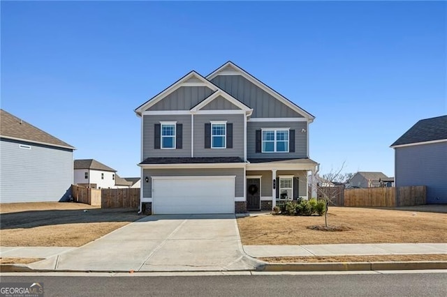 craftsman-style home with covered porch, an attached garage, board and batten siding, fence, and driveway