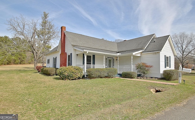 view of home's exterior with a porch and a yard