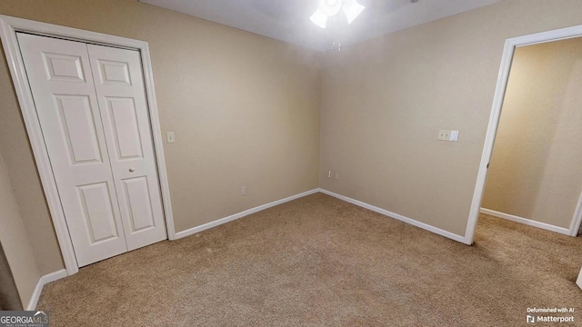 unfurnished bedroom featuring light carpet