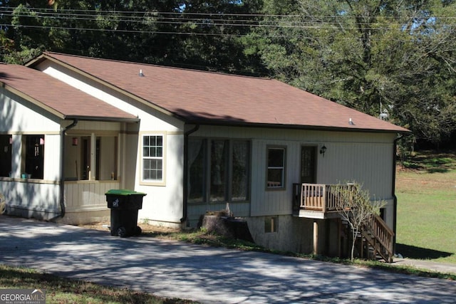 view of front of home featuring stairway