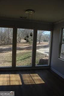 unfurnished sunroom featuring a wealth of natural light