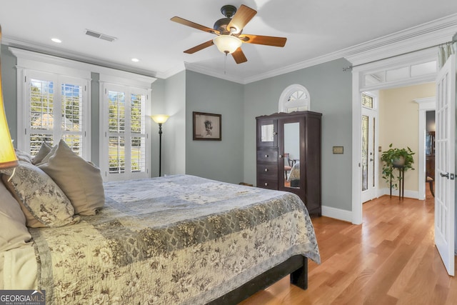 bedroom with ceiling fan, french doors, crown molding, and light hardwood / wood-style floors