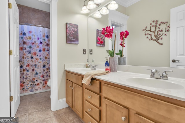 bathroom with ornamental molding, walk in shower, vanity, and toilet