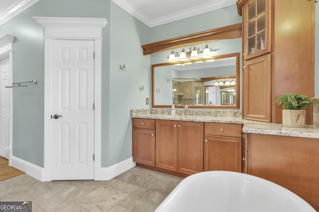 bathroom featuring a tub, vanity, and crown molding