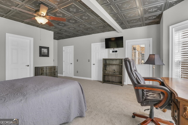 carpeted bedroom with two closets and ceiling fan