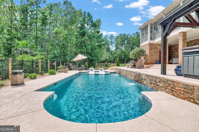 view of swimming pool featuring a patio area and pool water feature